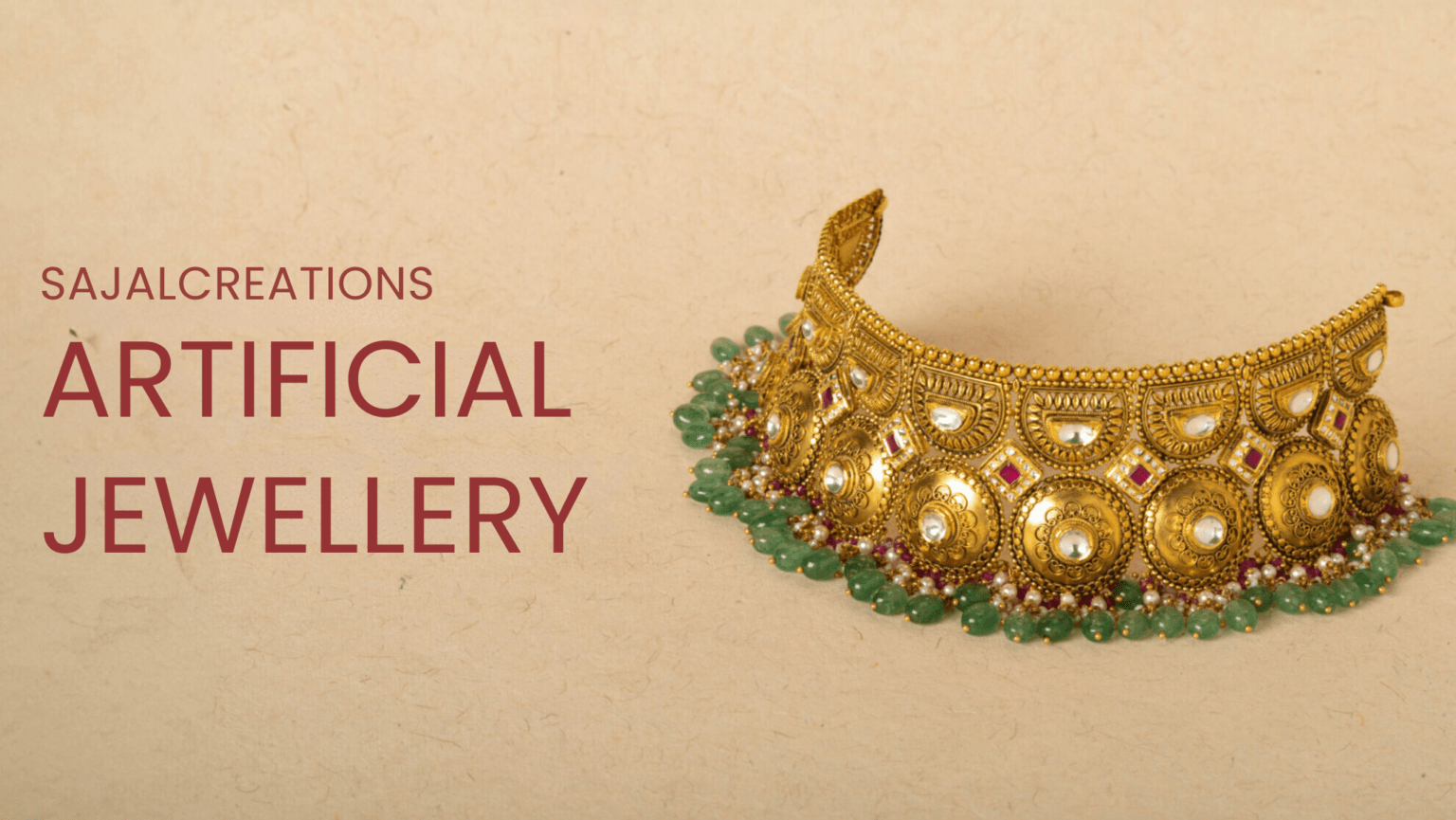 "Promotional banner for Sajal Creations, featuring a traditional artificial gold choker necklace with intricate designs, green and red beads, and embedded gemstones. The text reads 'Sajal Creations Artificial Jewellery' on a beige background."